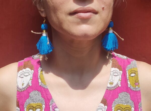 SVATANYA Doll Dangler Earrings in Blue on model