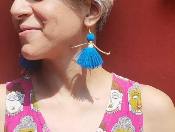SVATANYA Doll Dangler Earrings in Blue on model